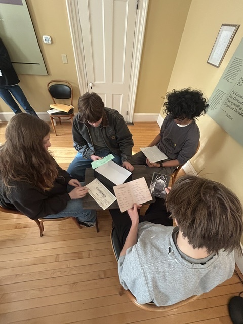 students looking at manuscripts
