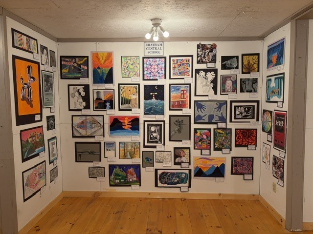 student artwork on display wall