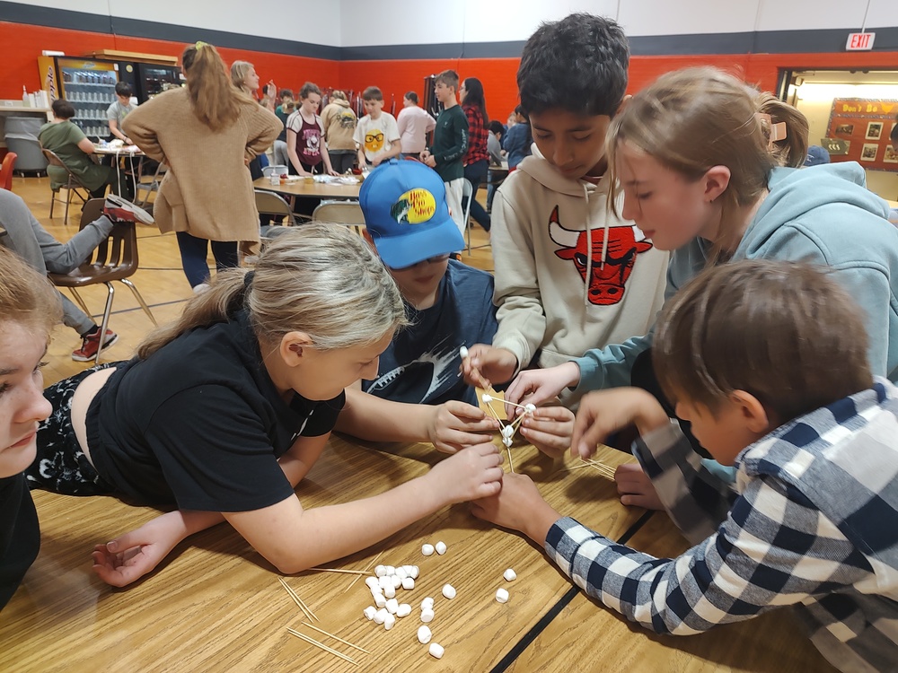 students building spaghetti and marshmallow towers