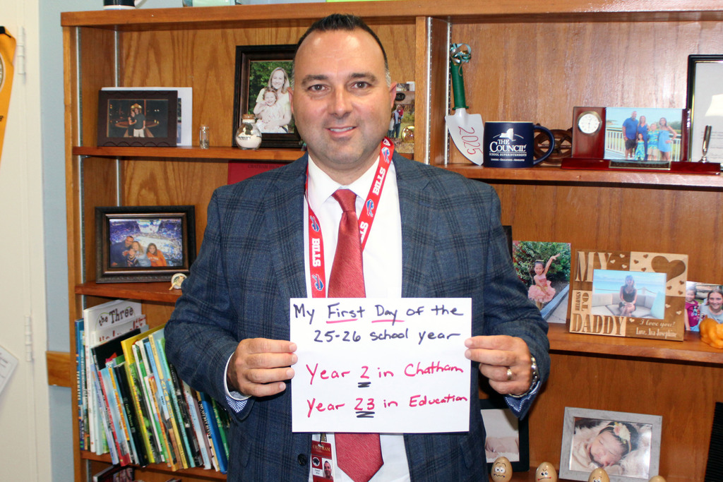 Andrew Kourt holding sign saying his first day of the 25-26 school year.
