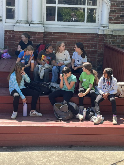 students seated on bleachers