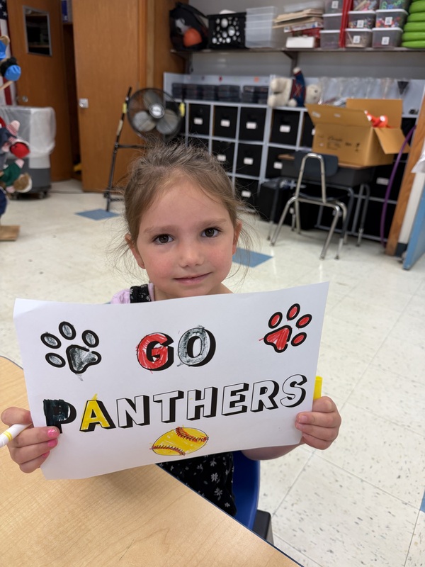 girl holding go panthers sign