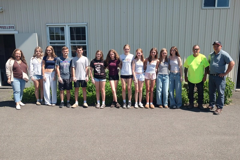 Builders Club poses with fair staff
