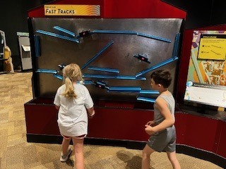student at museum exhibit
