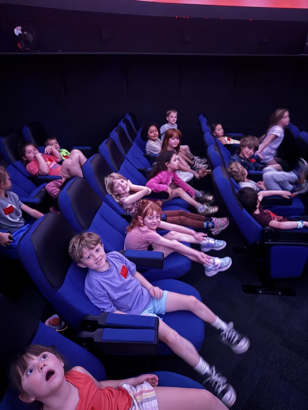 student in planetarium