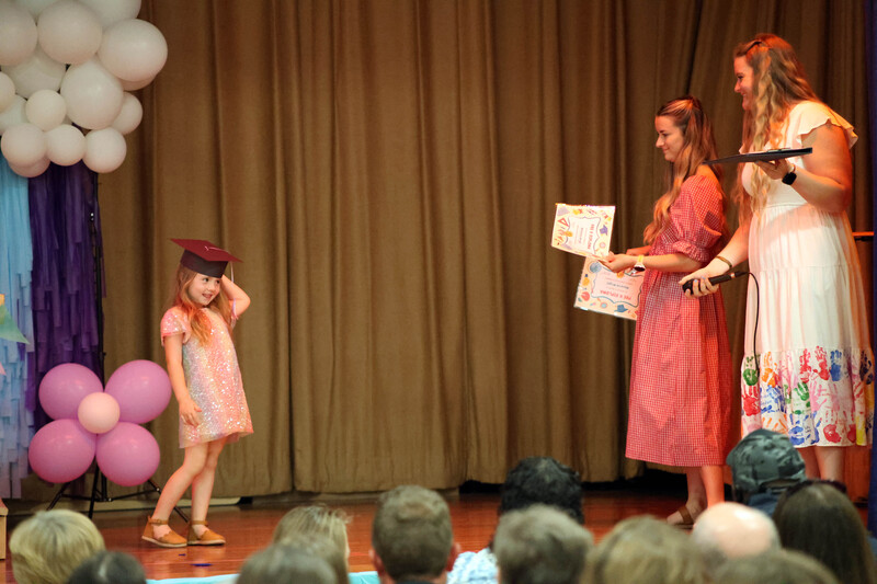 girl receiving certificate