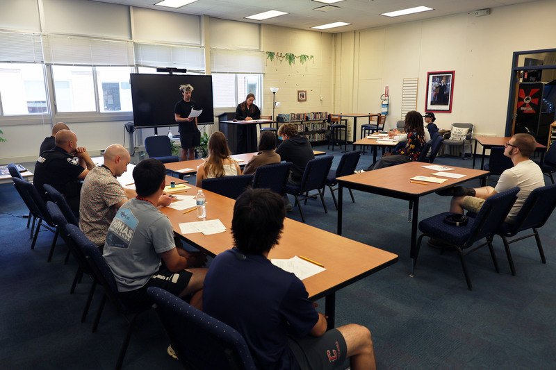 mock trial in CHS library wih students as prosecutors, defence, and witnesses