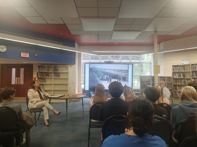 woman showing picture from Holocaust