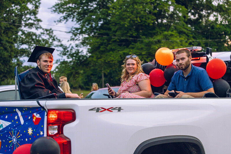 graduate in back of pickup truck