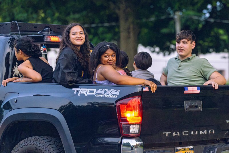 graduates in back of pickup truck