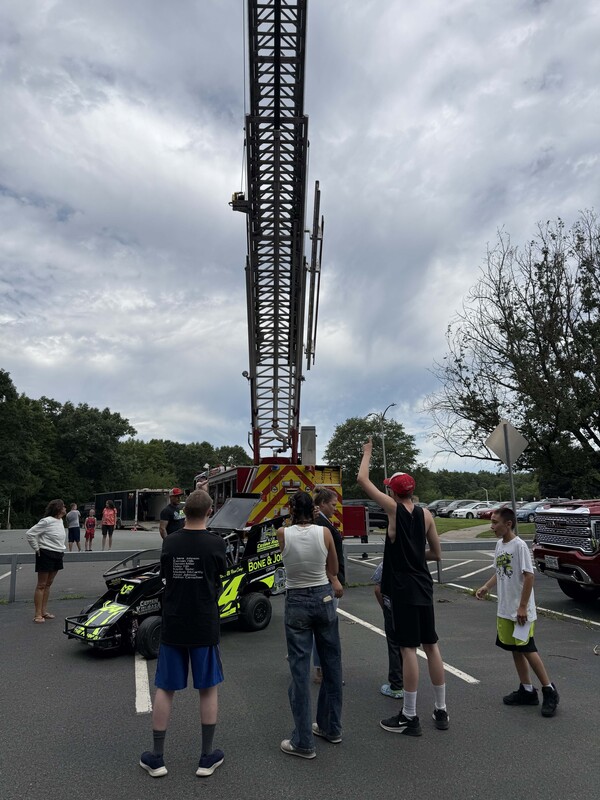 students looking at ladder truck