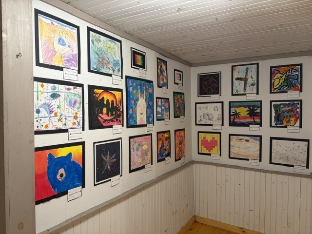 student artwork on display wall