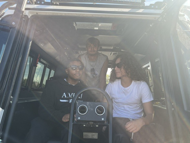 Students in power shovel cab