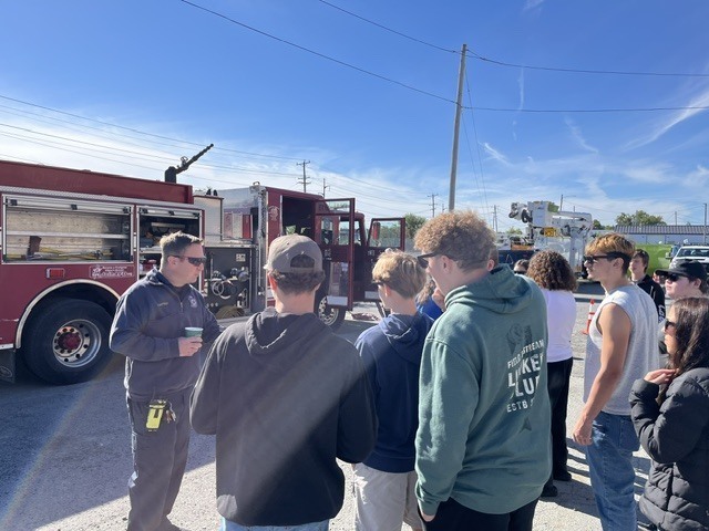 students looking at fire truck
