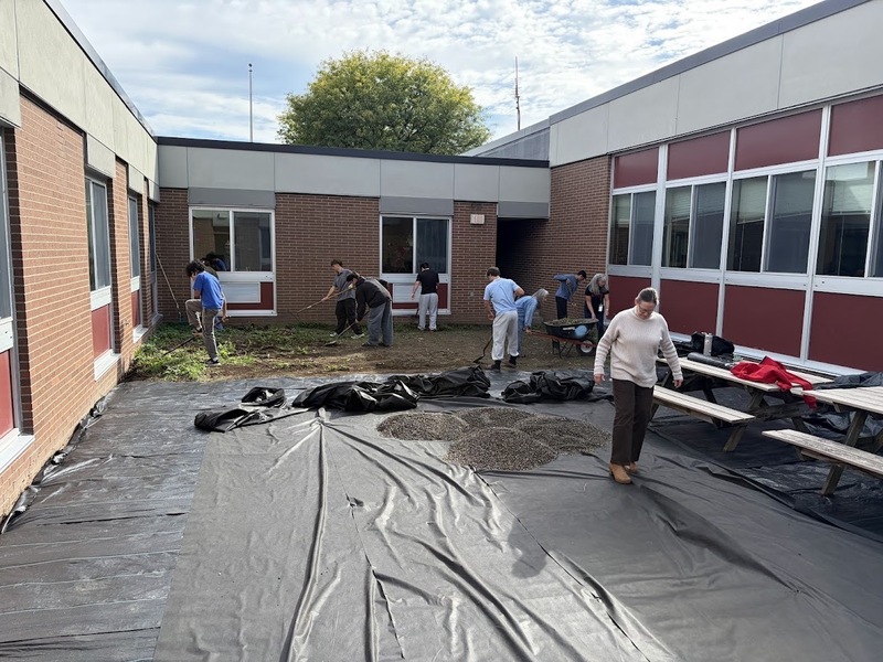 teachers and students working in court yard