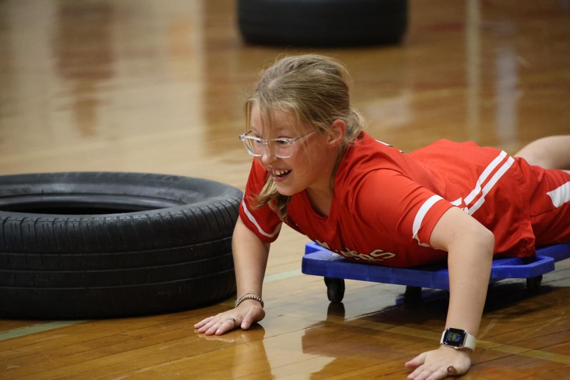 girl racing on floor dolly
