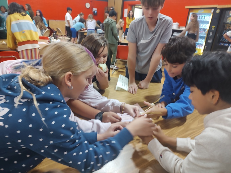 students building spaghetti towers