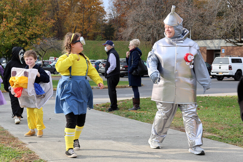 students and teacher in Halloween costumes