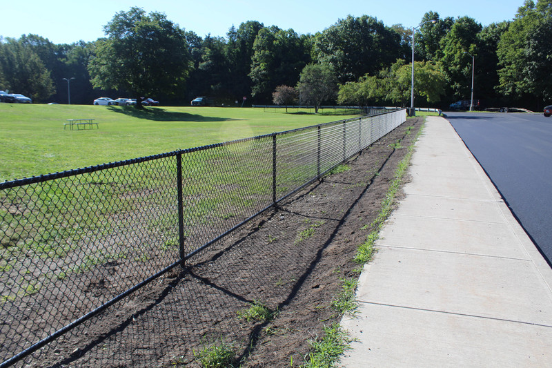 new fence along high school parking lot