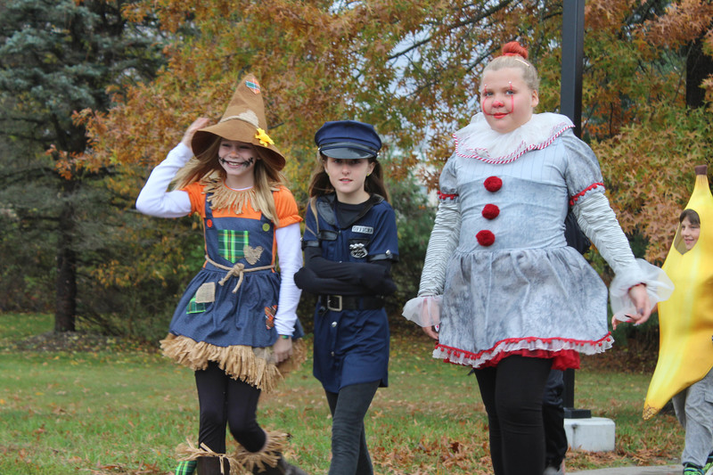 three girls in halloween costumes