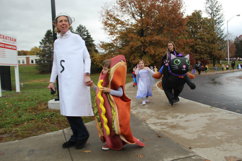 woman an boy in Halloween costumes