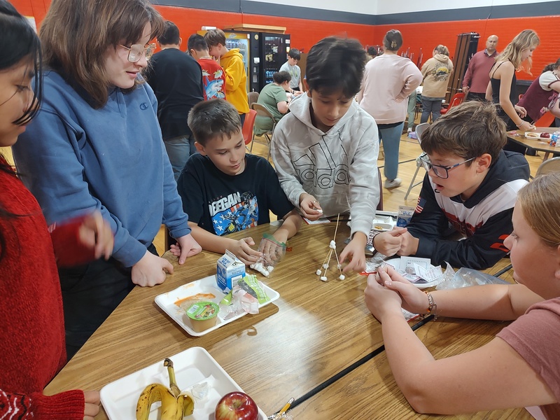 students building spaghetti and marshmallow towers