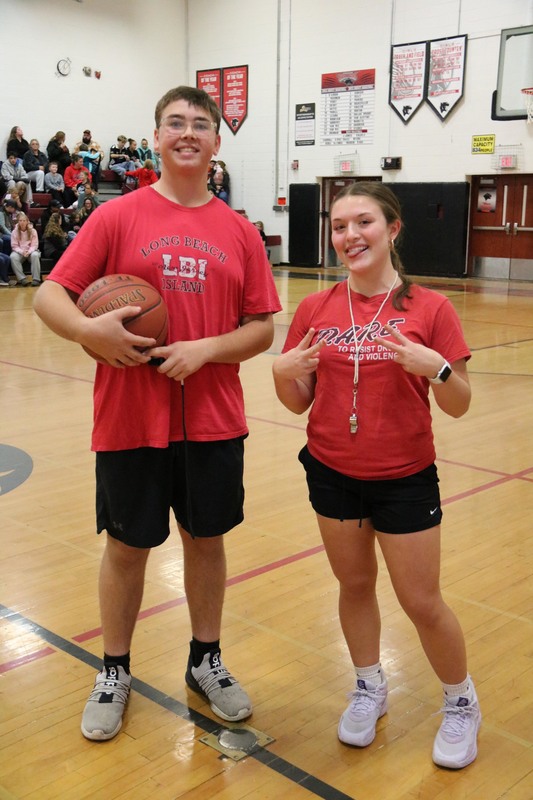 two students wearing red shirts