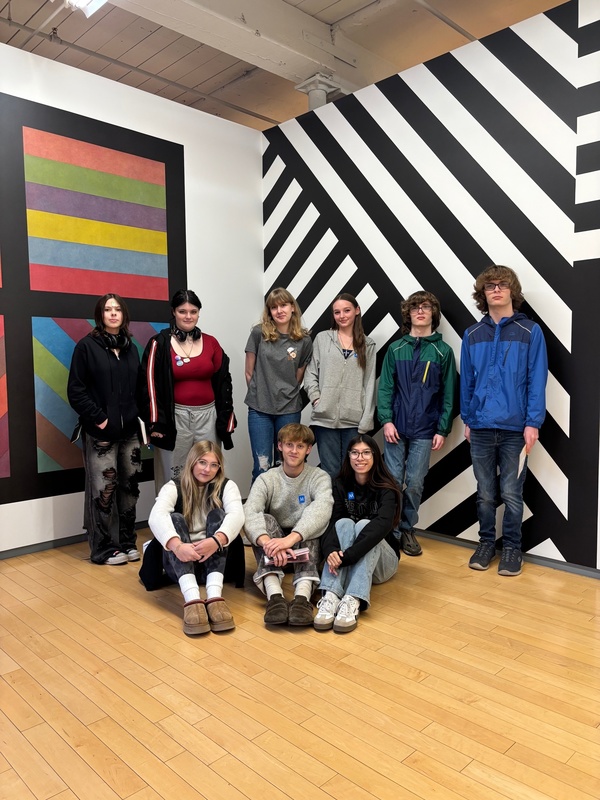 Media Arts class poses in front of art installation