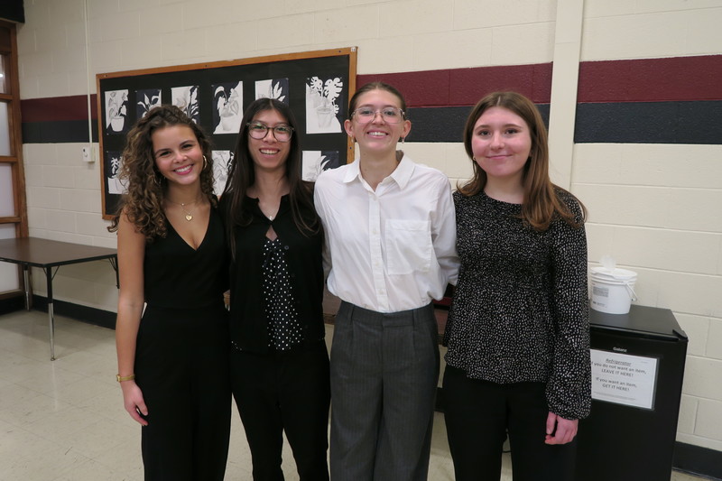 students in business attire pose for group photo