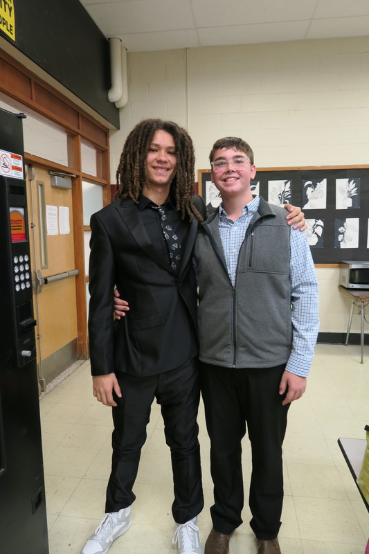 two young men wearing professional attire