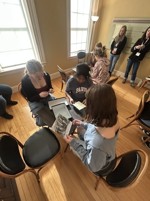 students looking at manuscripts