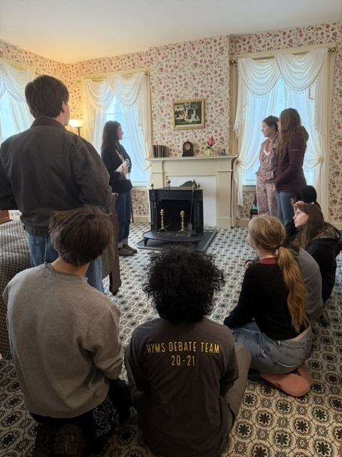 students taking tour of Emily Dickenson house
