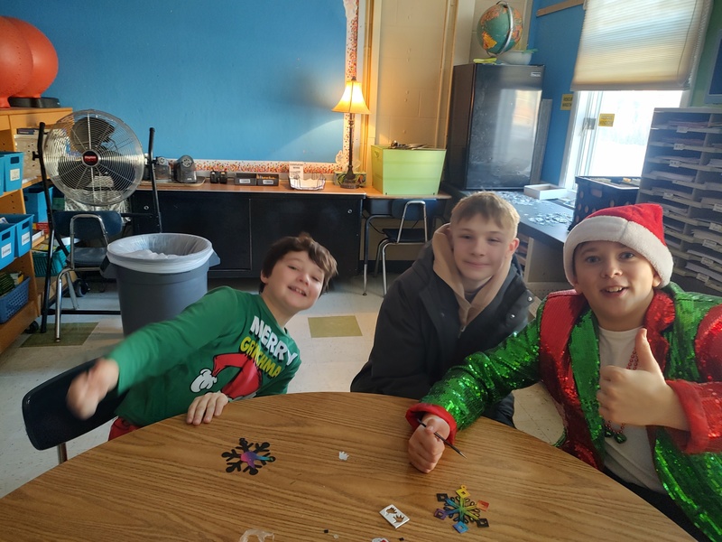 boys smiling and giving the thumbs up sign