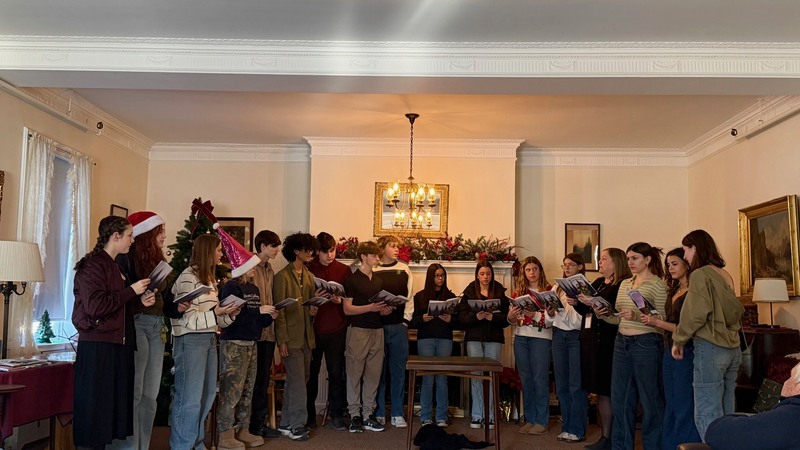 Choral Students singing in the Payne Home