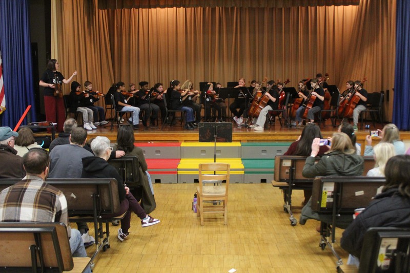 grade four orchestra playing on cafetorium stage