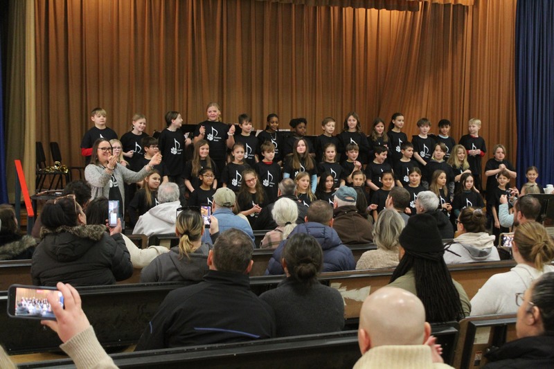 grade 4 chorus singing on risers