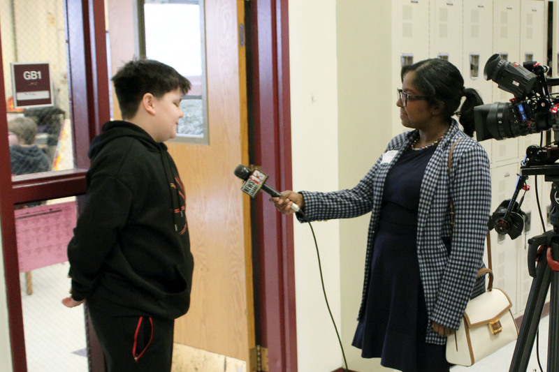 Tamara Starr talking with boy on camera