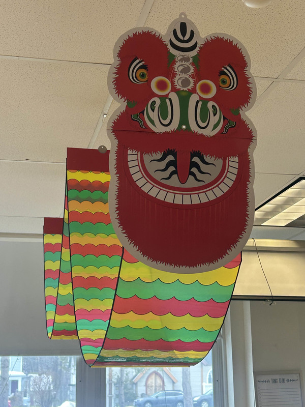 paper dragon hanging from ceiling