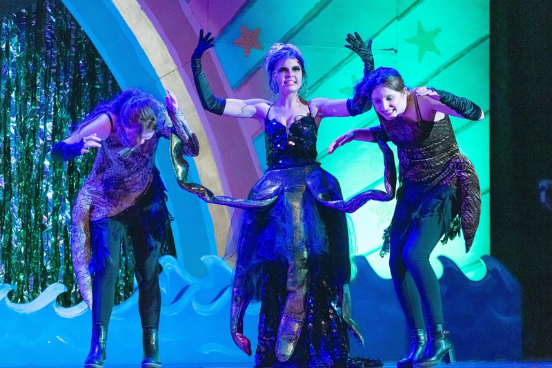 girls dressed up as evil sea witch and her cronies on stage