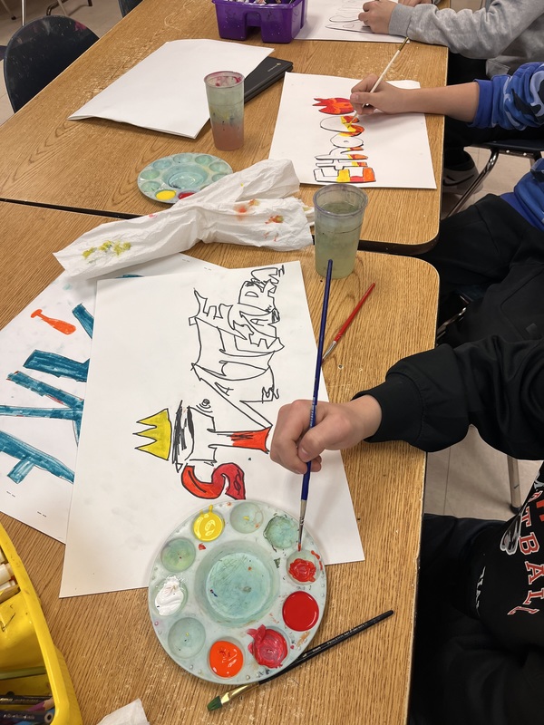 students painting graffiti style art on paper