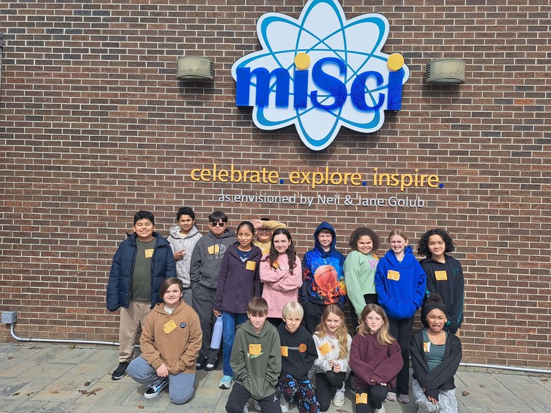 students pose for group photo in front of MiSci Museum