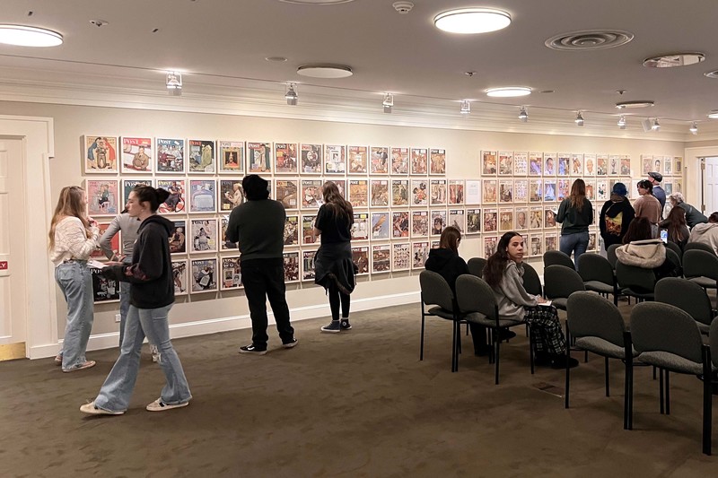 students looking at wall of art