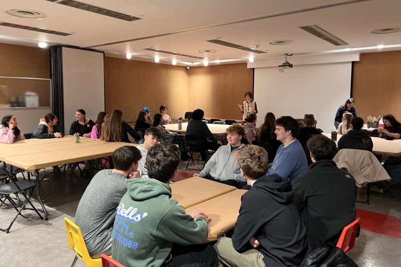 students sitting at tables