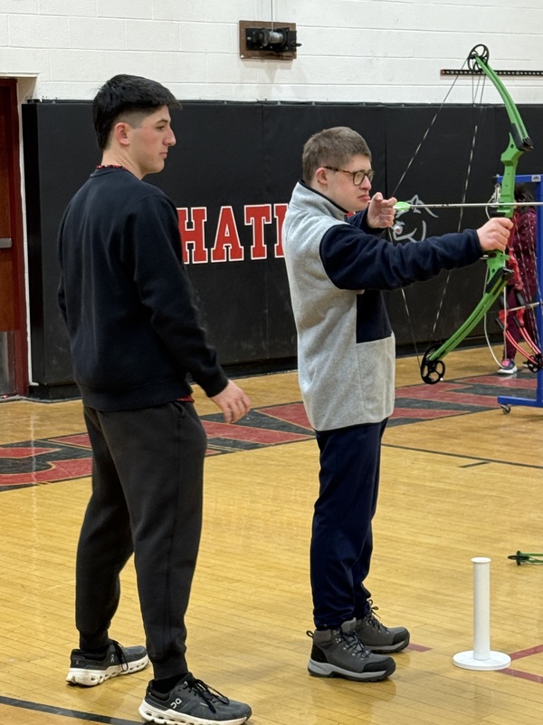 boy drawing bow and arrow