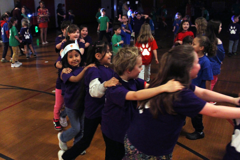 students dancing in Conga line