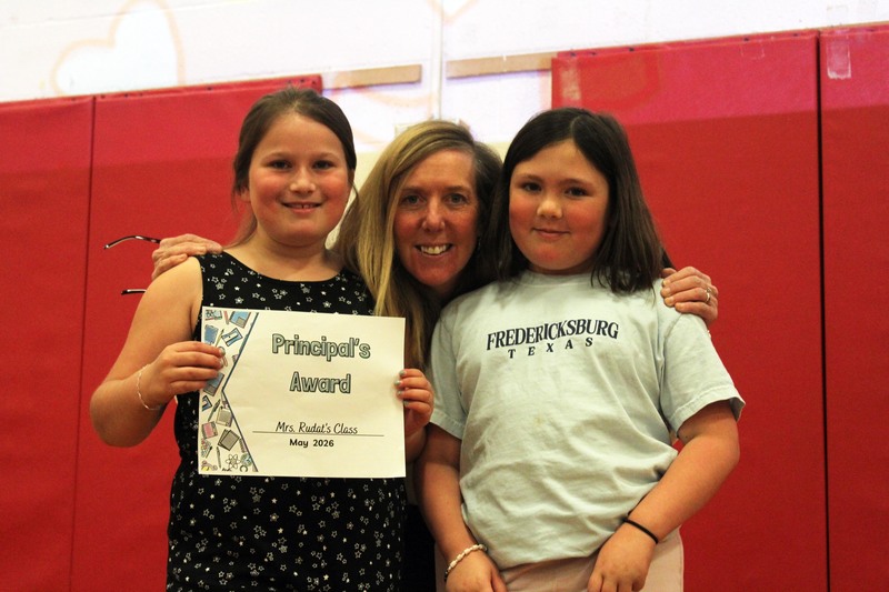 woman and two girls pose with principal's ward
