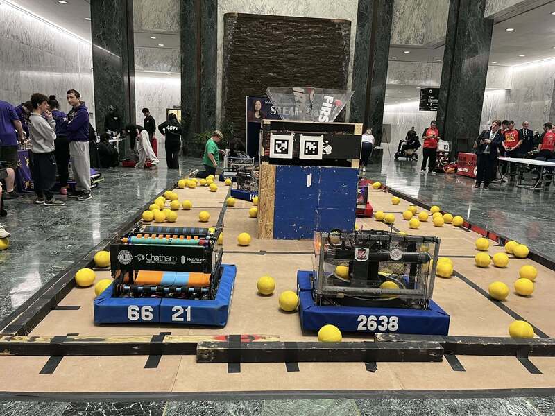robots demonstrating lpicking up balls in Legislative Office Building