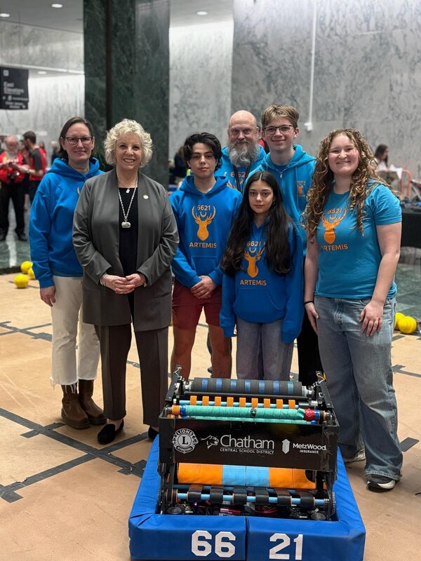 Did Barrett and robotics team pose with robot