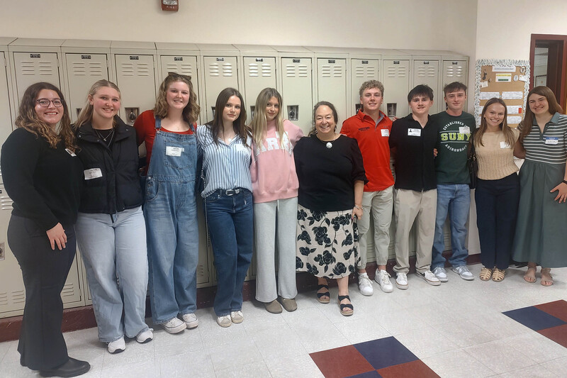 chatham grads pose with Mrs. Hoffman
