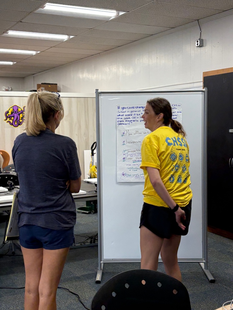 Teachers working in a group at a school library.